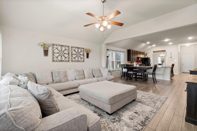 15111 Raffia Leaves Way, Houston, TX 77090 - living room with vaulted ceiling, a ceiling fan, light wood-style floors, baseboards, and recessed lighting
