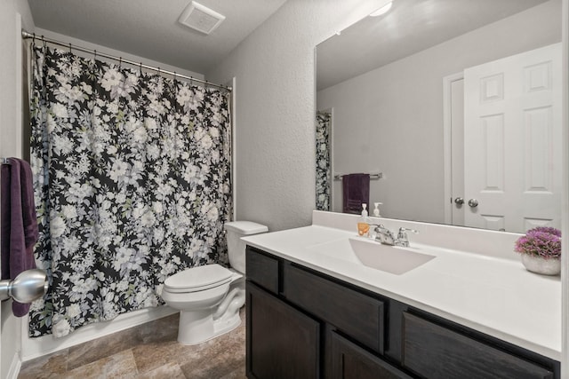 15111 Raffia Leaves Way, Houston, TX 77090 - bathroom featuring vanity, toilet, a textured wall, and stone finish flooring