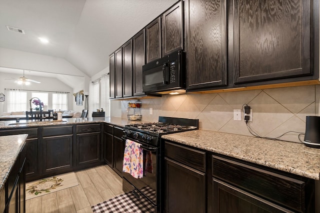 15111 Raffia Leaves Way, Houston, TX 77090 - kitchen featuring black appliances, vaulted ceiling, backsplash, a sink, and dark brown cabinets