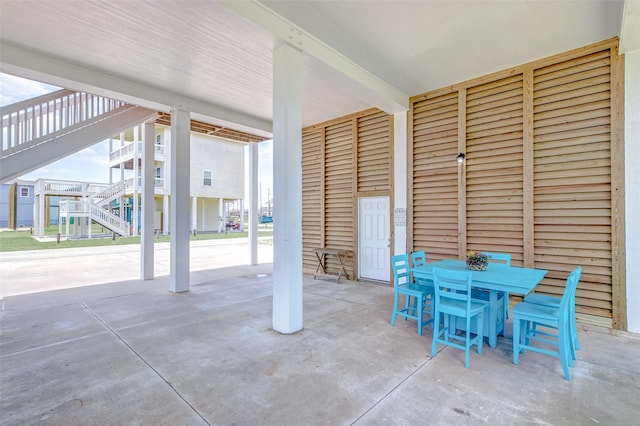 2774 Gulfview Ln, Crystal Beach, TX 77650 - view of patio / terrace with outdoor dining space and stairway