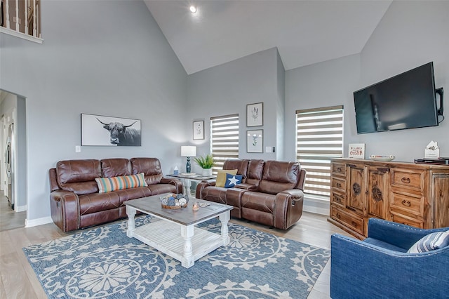 2774 Gulfview Ln, Crystal Beach, TX 77650 - living area with high vaulted ceiling, wood finished floors, and baseboards