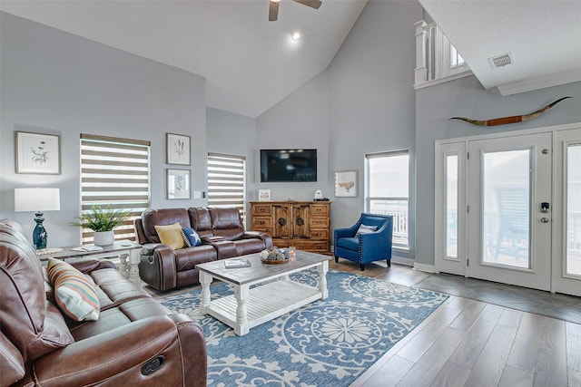 2774 Gulfview Ln, Crystal Beach, TX 77650 - living room with high vaulted ceiling, ceiling fan, and wood finished floors