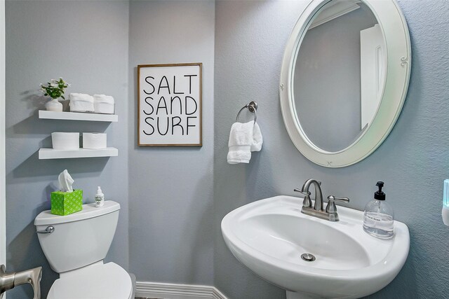 2774 Gulfview Ln, Crystal Beach, TX 77650 - half bathroom with a sink and toilet