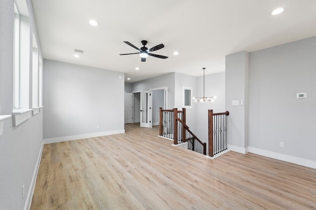 6631 Foster St, Houston, TX 77021 - unfurnished room with recessed lighting, light wood-style flooring, baseboards, a ceiling fan, and a chandelier