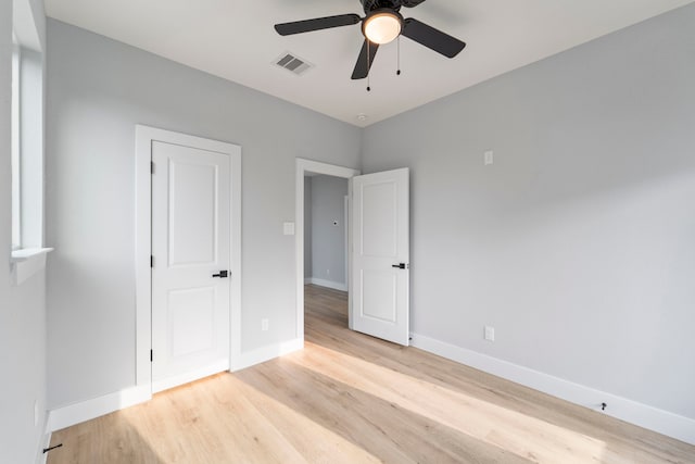 6631 Foster St, Houston, TX 77021 - unfurnished bedroom with light wood finished floors, baseboards, and a ceiling fan