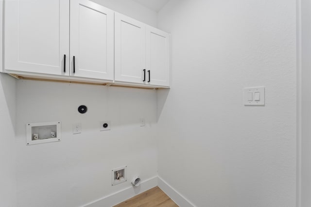 6631 Foster St, Houston, TX 77021 - laundry room with hookup for an electric dryer, cabinet space, gas dryer hookup, baseboards, and hookup for a washing machine