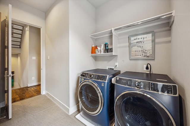 2707 Rusk St, Houston, TX 77003 - washroom with washing machine and clothes dryer and baseboards