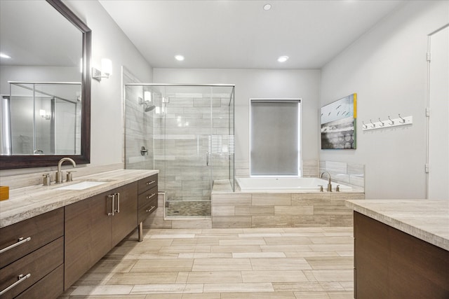 2707 Rusk St, Houston, TX 77003 - full bathroom with vanity, a bath, a shower stall, and recessed lighting