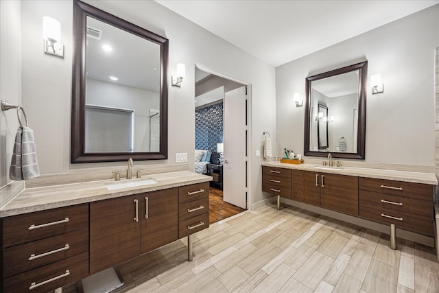 2707 Rusk St, Houston, TX 77003 - ensuite bathroom featuring two vanities and wood finished floors