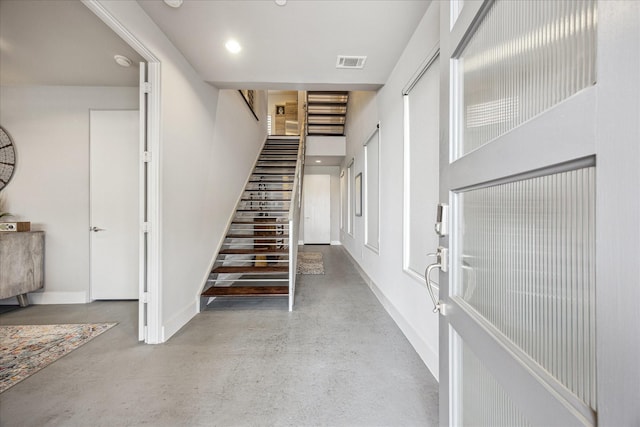 2707 Rusk St, Houston, TX 77003 - stairs with baseboards and finished concrete floors