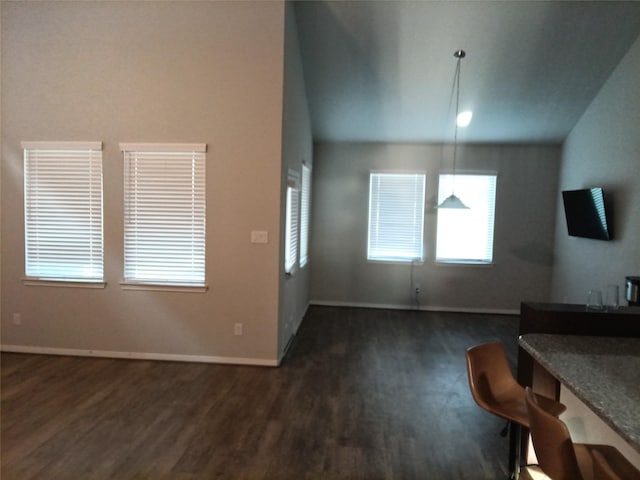 3619 Dry Creek Dr, Missouri City, TX 77459 - unfurnished living room with dark wood-type flooring, baseboards, and vaulted ceiling