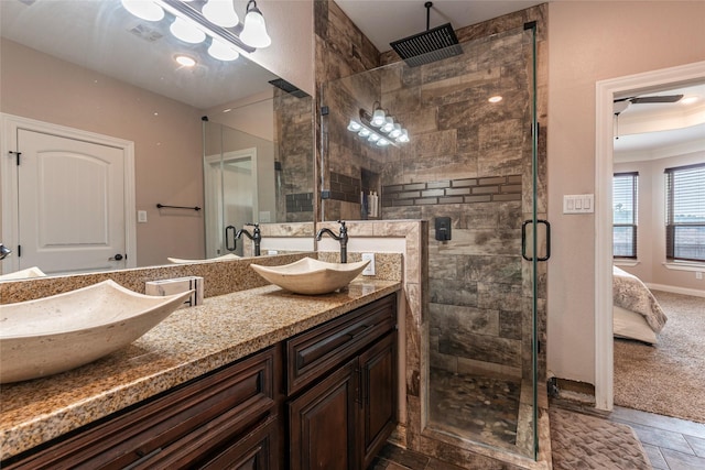 2323 Foley Rd, Crosby, TX 77532 - ensuite bathroom with a stall shower, double vanity, and ornamental molding