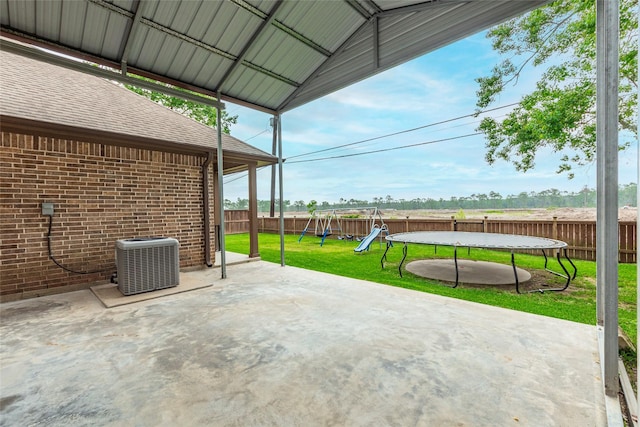2323 Foley Rd, Crosby, TX 77532 - fenced backyard with a trampoline, a patio, and a playground