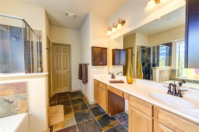 19902 Dayton Ridge Ln, Cypress, TX 77433 - full bath with a shower stall, double vanity, stone tile flooring, and baseboards