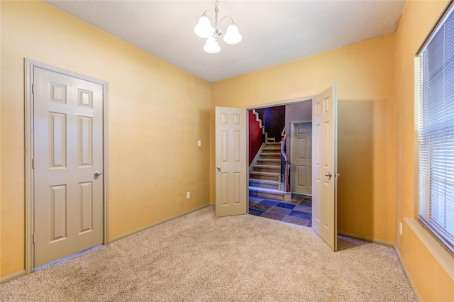 19902 Dayton Ridge Ln, Cypress, TX 77433 - unfurnished bedroom featuring a chandelier, carpet, and baseboards