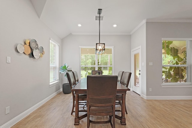 1603 Country Club Dr, Crosby, TX 77532 - dining area with light wood-style flooring, baseboards, recessed lighting, crown molding, and lofted ceiling