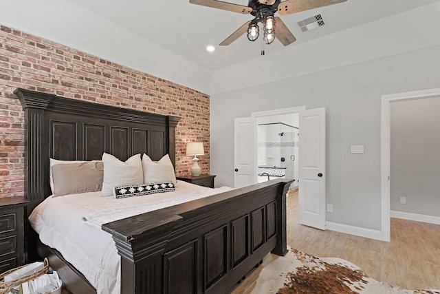 1603 Country Club Dr, Crosby, TX 77532 - bedroom with light wood finished floors, baseboards, brick wall, and a ceiling fan