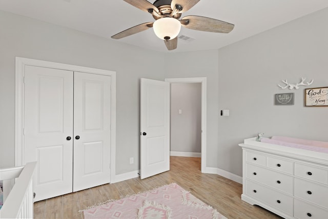 1603 Country Club Dr, Crosby, TX 77532 - bedroom featuring light wood-style flooring, a closet, baseboards, and ceiling fan