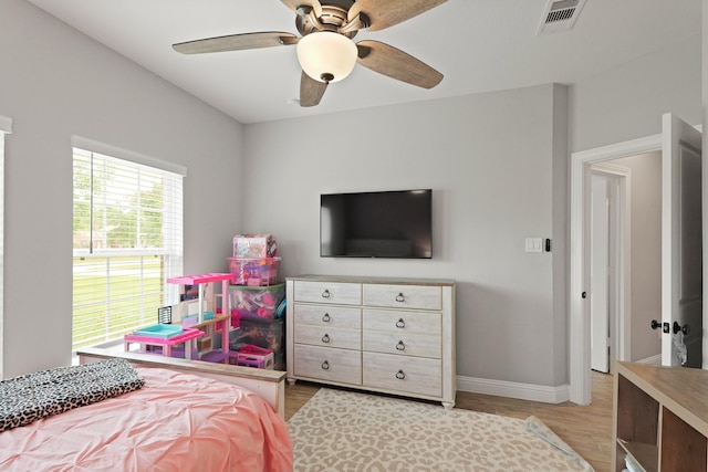 1603 Country Club Dr, Crosby, TX 77532 - bedroom featuring light wood-type flooring, baseboards, and ceiling fan