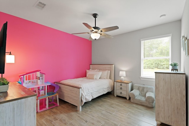 1603 Country Club Dr, Crosby, TX 77532 - bedroom featuring wood finished floors and ceiling fan