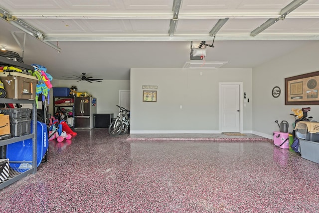 1603 Country Club Dr, Crosby, TX 77532 - garage with a garage door opener, freestanding refrigerator, and baseboards