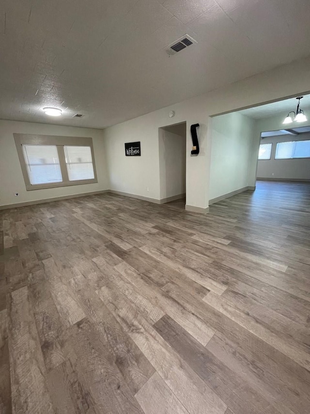 1602 W Blum St, Alvin, TX 77511 - spare room with wood finished floors and baseboards