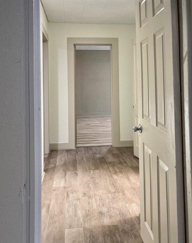 1602 W Blum St, Alvin, TX 77511 - corridor with wood finished floors and baseboards