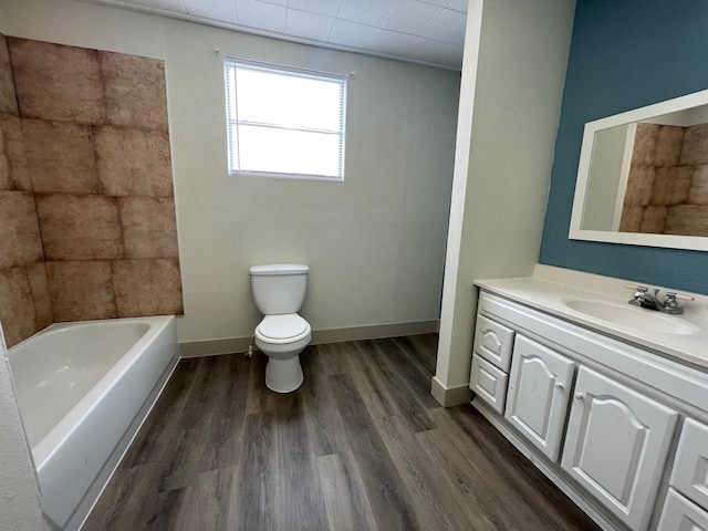 1602 W Blum St, Alvin, TX 77511 - full bathroom featuring vanity, toilet, and wood finished floors