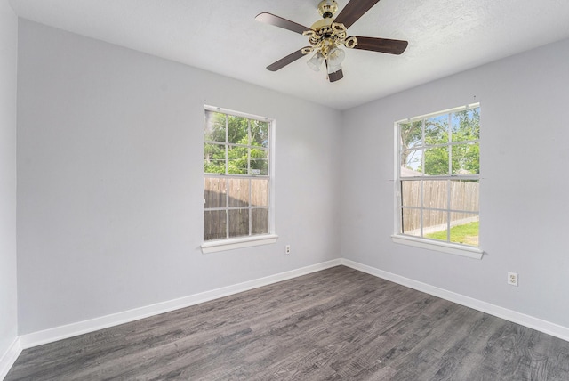 3517 Sparrow St, Houston, TX 77051 - spare room with dark wood-style flooring, baseboards, and a ceiling fan