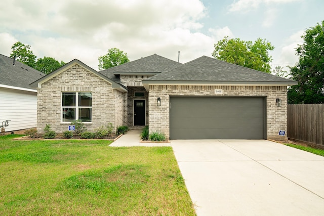 3405 Rebecca St, Houston, TX 77021 - french country home with brick siding, roof with shingles, an attached garage, and concrete driveway