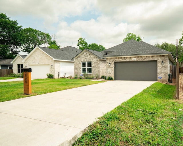 3405 Rebecca St, Houston, TX 77021 - view of front of home with brick siding, an attached garage, driveway, and a shingled roof
