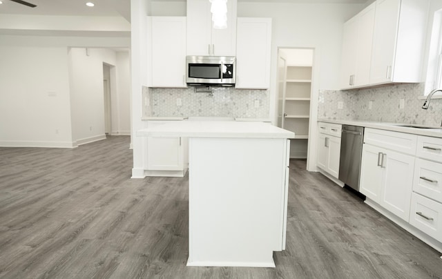 3405 Rebecca St, Houston, TX 77021 - kitchen with appliances with stainless steel finishes, a sink, tasteful backsplash, a center island, and light countertops
