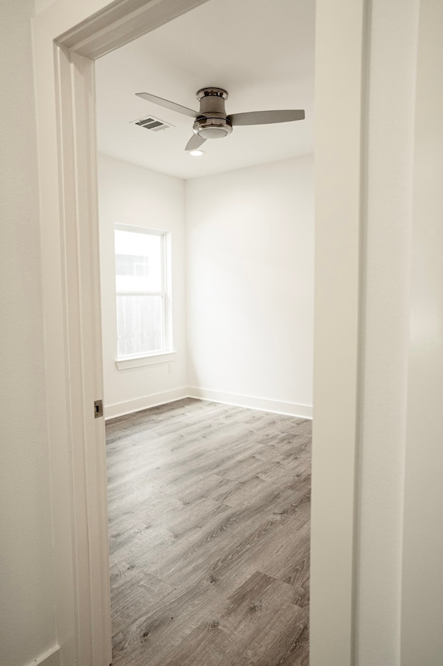 3405 Rebecca St, Houston, TX 77021 - empty room featuring wood finished floors, a ceiling fan, and baseboards
