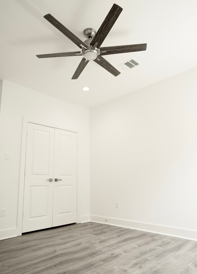 3405 Rebecca St, Houston, TX 77021 - unfurnished bedroom with light wood finished floors, recessed lighting, baseboards, ceiling fan, and a closet