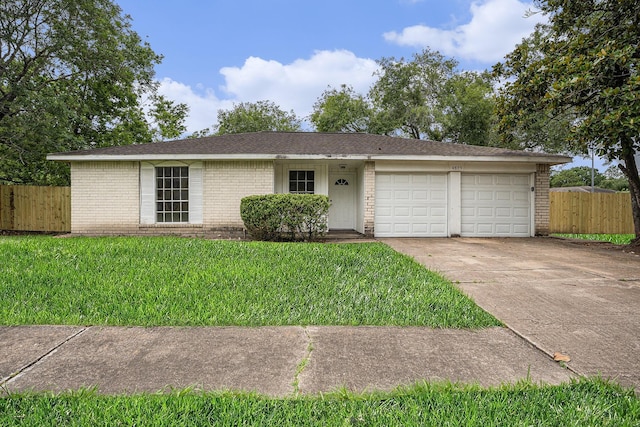 4875 Beechaven St, Houston, TX 77053 - ranch-style house with brick siding, a garage, and driveway