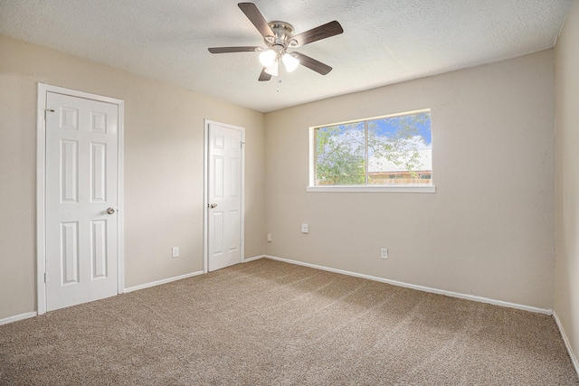 4875 Beechaven St, Houston, TX 77053 - unfurnished bedroom featuring carpet flooring, a textured ceiling, baseboards, and a ceiling fan