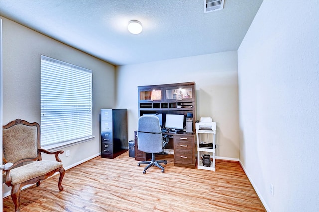 5838 Deleon Trail Dr, Spring, TX 77379 - office with light wood-style floors, baseboards, and a textured ceiling