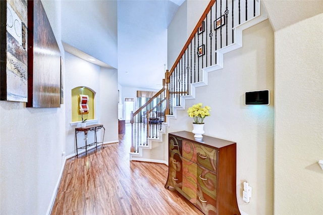 5838 Deleon Trail Dr, Spring, TX 77379 - entrance foyer with stairway, wood finished floors, baseboards, and a high ceiling