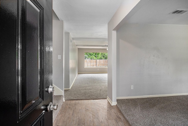 6814 Indian Falls Dr, Houston, TX 77489 - carpeted foyer entrance featuring baseboards and wood finished floors