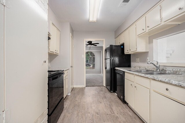 6814 Indian Falls Dr, Houston, TX 77489 - kitchen featuring black appliances, a sink, light countertops, light wood-style flooring, and ceiling fan