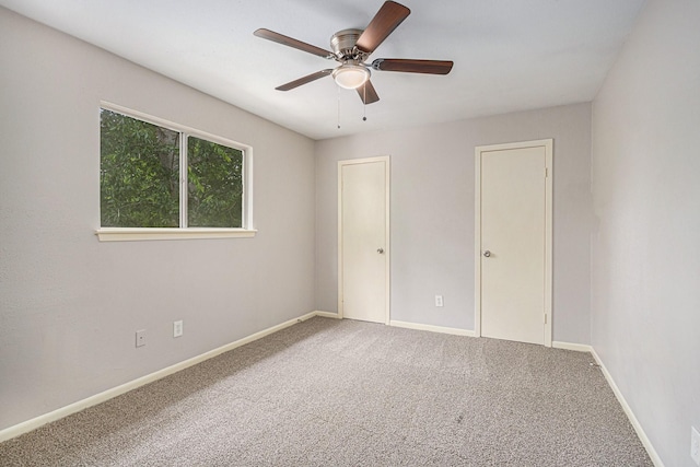6814 Indian Falls Dr, Houston, TX 77489 - unfurnished bedroom with carpet flooring, baseboards, and a ceiling fan