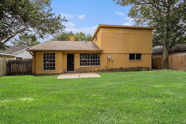 6814 Indian Falls Dr, Houston, TX 77489 - rear view of property featuring a patio, a chimney, and brick siding