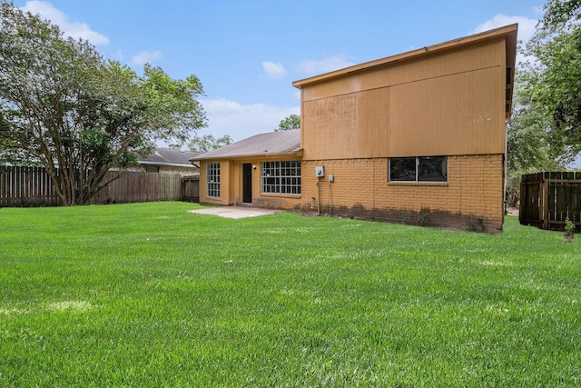 6814 Indian Falls Dr, Houston, TX 77489 - rear view of house featuring brick siding and a patio
