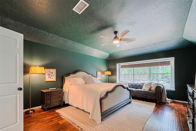 22 Tallow Hill Pl, Spring, TX 77382 - bedroom featuring a textured ceiling, hardwood / wood-style flooring, baseboards, and ceiling fan