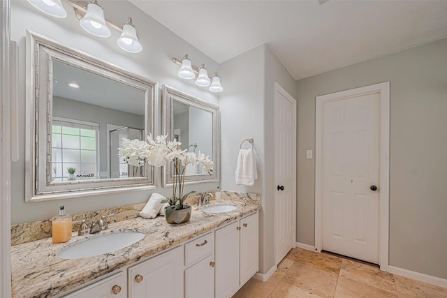 22 Tallow Hill Pl, Spring, TX 77382 - bathroom with double vanity and baseboards