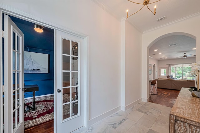 22 Tallow Hill Pl, Spring, TX 77382 - hallway with ornamental molding, french doors, arched walkways, baseboards, and a chandelier