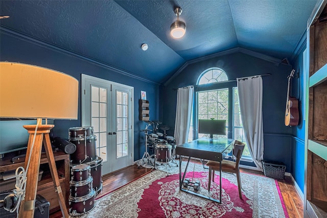 22 Tallow Hill Pl, Spring, TX 77382 - office featuring french doors, wood finished floors, vaulted ceiling, a textured ceiling, and crown molding