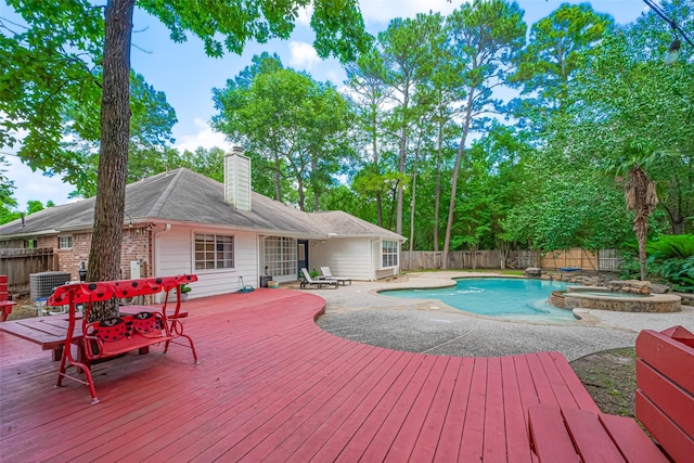 22 Tallow Hill Pl, Spring, TX 77382 - view of pool featuring a wooden deck, a fenced backyard, central AC unit, and a pool with connected hot tub
