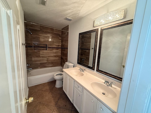 9619 Therrell Dr, Houston, TX 77064 - bathroom with toilet, double vanity, a textured ceiling, shower / washtub combination, and tile patterned floors