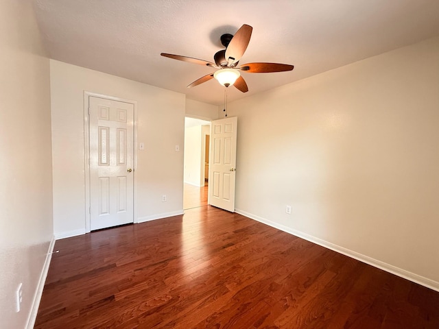 9619 Therrell Dr, Houston, TX 77064 - unfurnished room featuring a ceiling fan, dark wood finished floors, and baseboards
